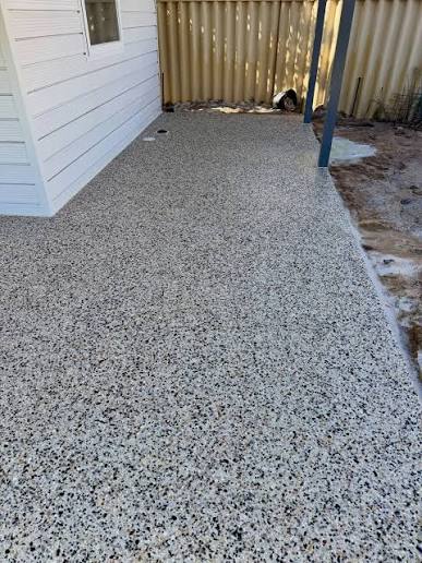Exposed aggregate path poured alongside a weatherboard house